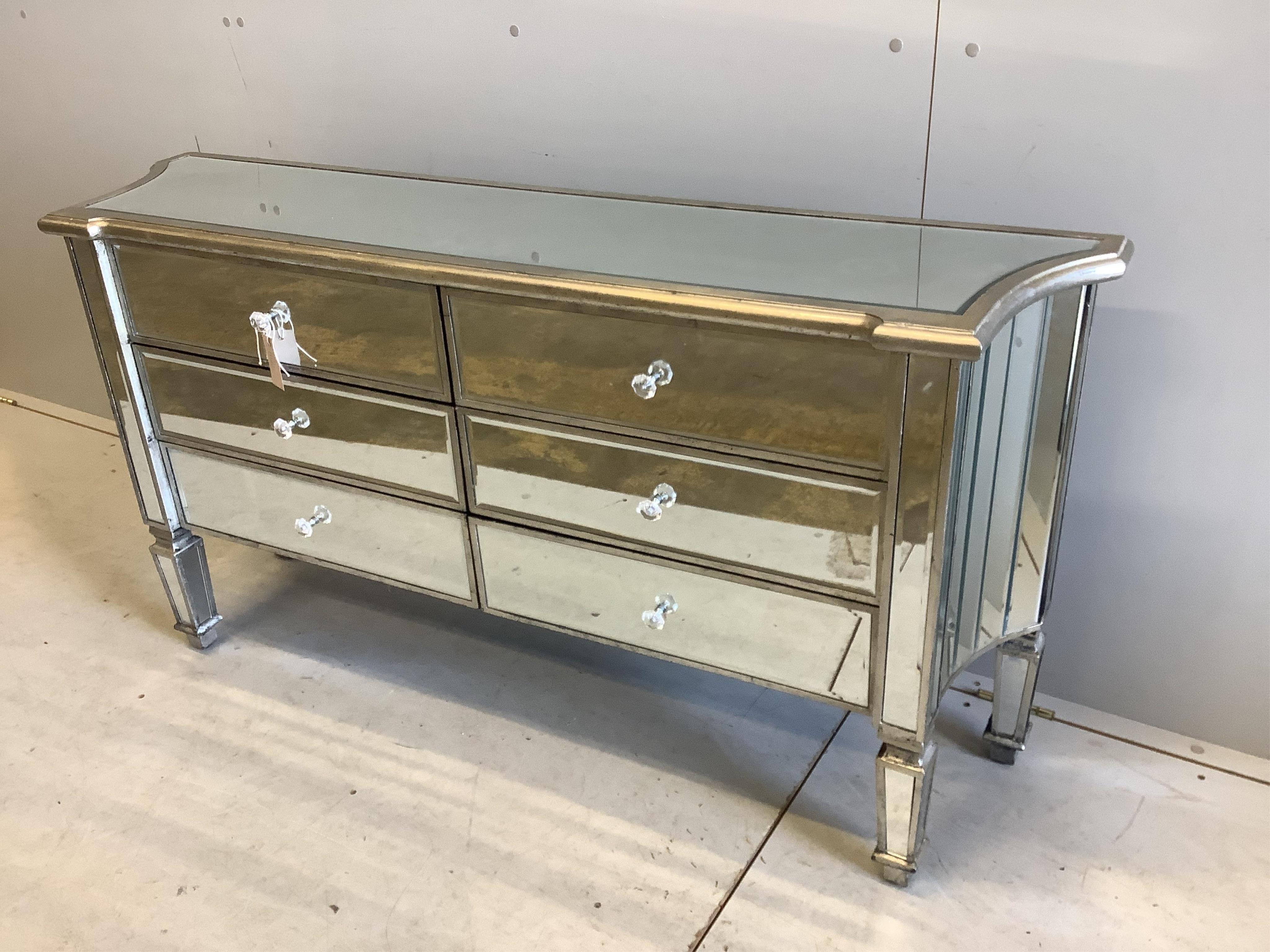 A Contemporary mirrored chest of drawers, width 138cm, depth 34cm, height 73cm. Condition - good